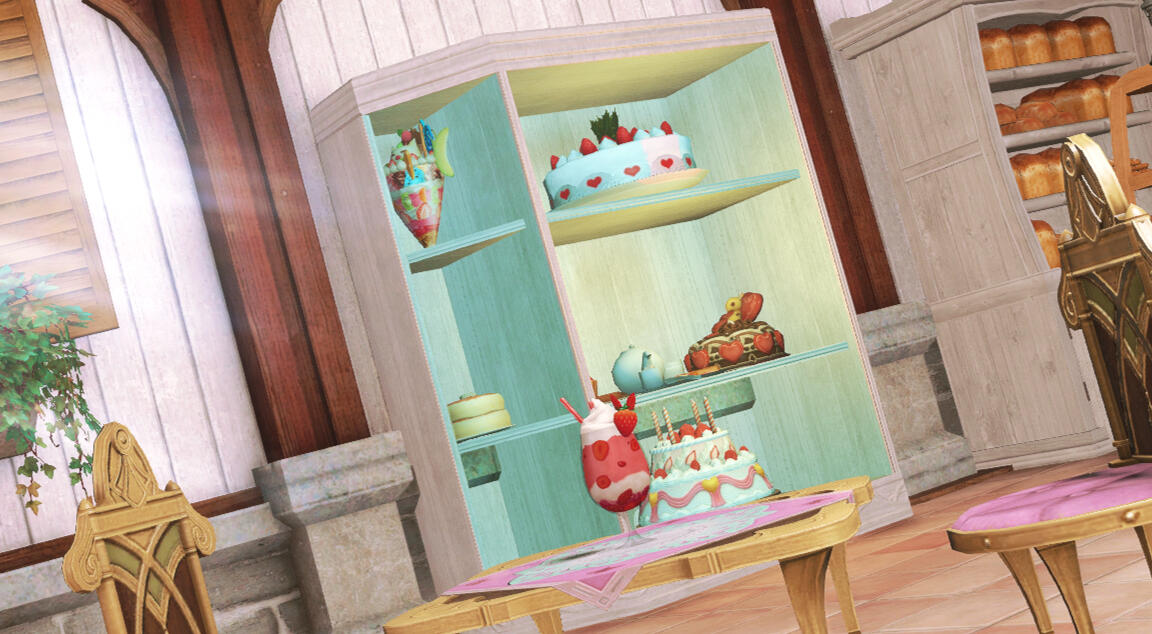A shot of a display cabinet filled with cakes and pastries.